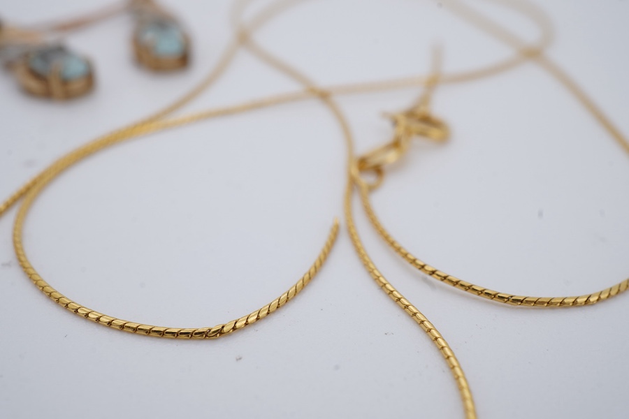 A group of jewels, comprising: a pair of garnet drop earrings; and a broken gold chain, each in 9ct gold, both with British hallmarks; a garnet pendant; and a pair of blue topaz and diamond earrings, each mounted in gold